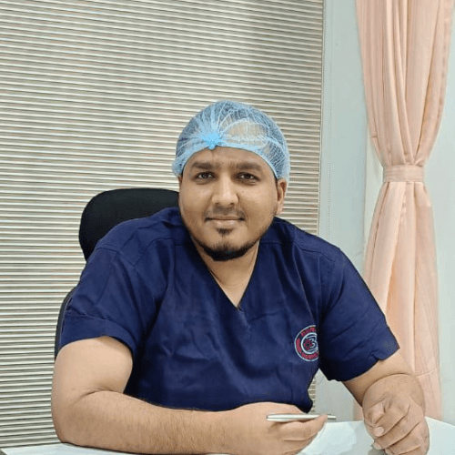 Dr. Qasim Khan in surgical attire
